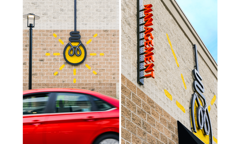 Four large lightbulbs hang down along a wall with white trace-LED "neon" that make up the filament and a yellow halo illumination that glows on the yellow painted wall. Photo credit: Vivian Marie Doering